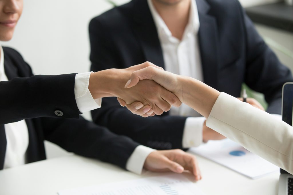 handshake between business professionals