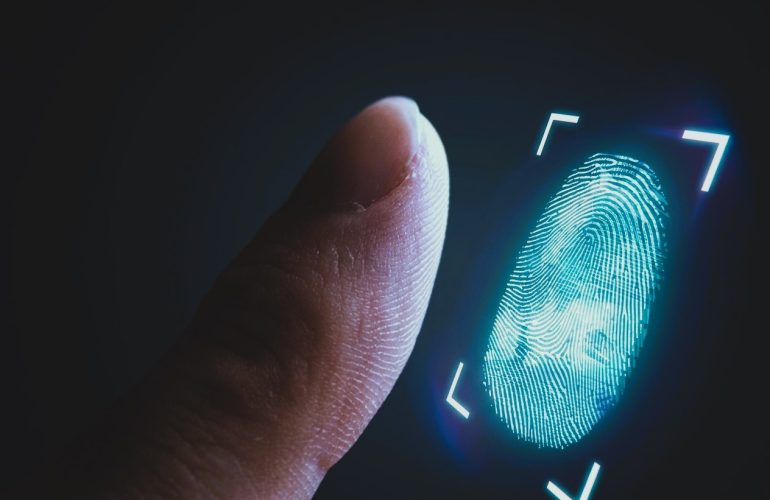 Finger being scanned by digital fingerprint biometric
