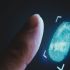 Finger being scanned by digital fingerprint biometric